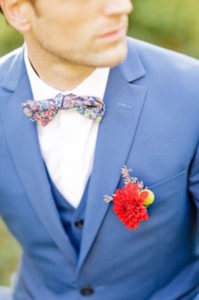 Groom-With-Patterned-Bowtie-And-Flower