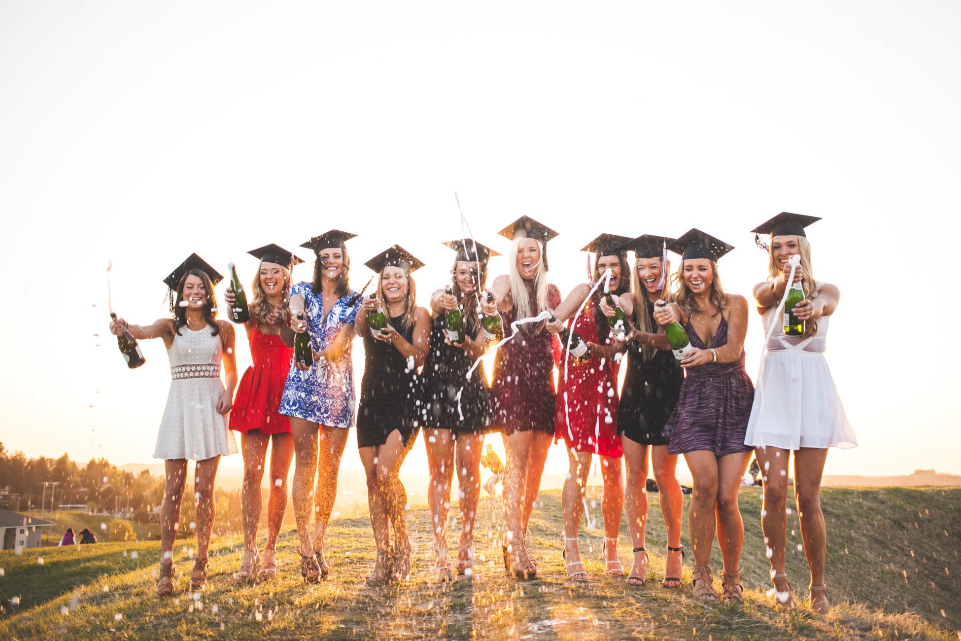 group of girls celebrating graduation - graduation party ideas
